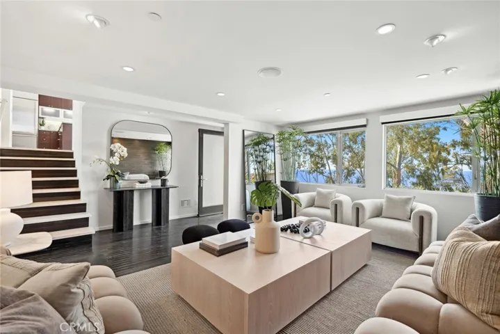 A translucent glass entry door provides a modern introduction to the home, which spans approximately 2,152 square feet.