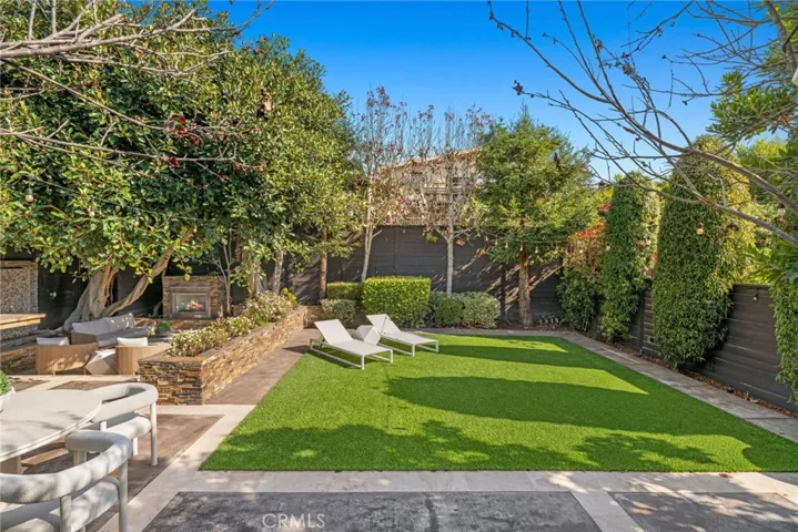 An exceptionally rare double lot allows ample room for an enviably private backyard at the rear of the home, extending the main level to an entertainer’s oasis.