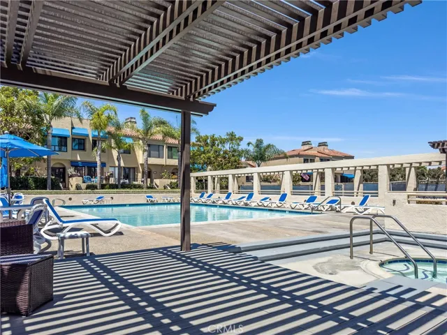 POOL VIEW TO LOUNGE CHAIRS AND PATIO COVER
