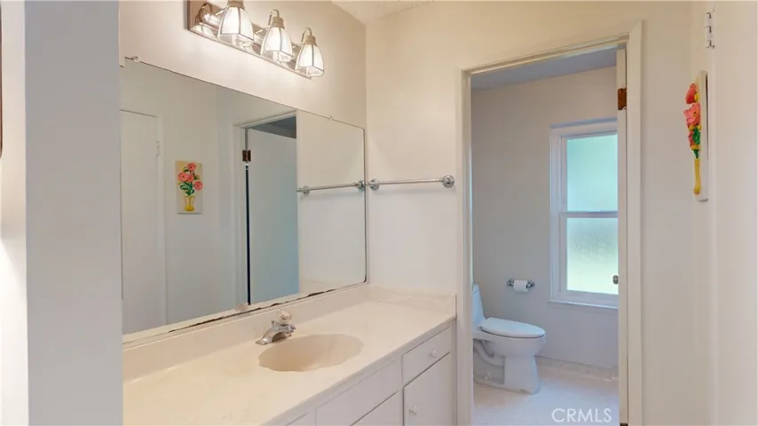 Primary Bath with adjacent walk in closet