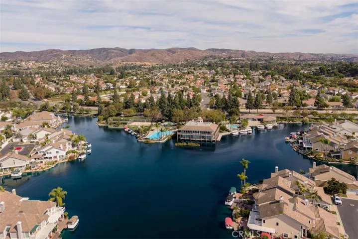 Overview of the lake and clubhouse. Not in this photo, but to the right on Village Center Drive is the community fitness center with jr olympic-sized pool