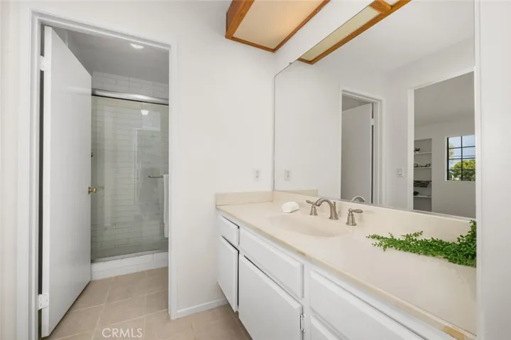 Main bedroom has ensuite bathroom and walkin closet, large vanity areas