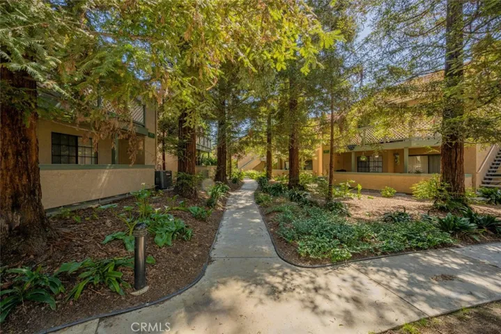 Evergreen Village has beautiful mature landscaping and grassy areas