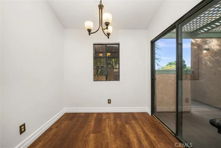 This breakfast nook at the end of the kitchen could make an ideal work from home desk areas