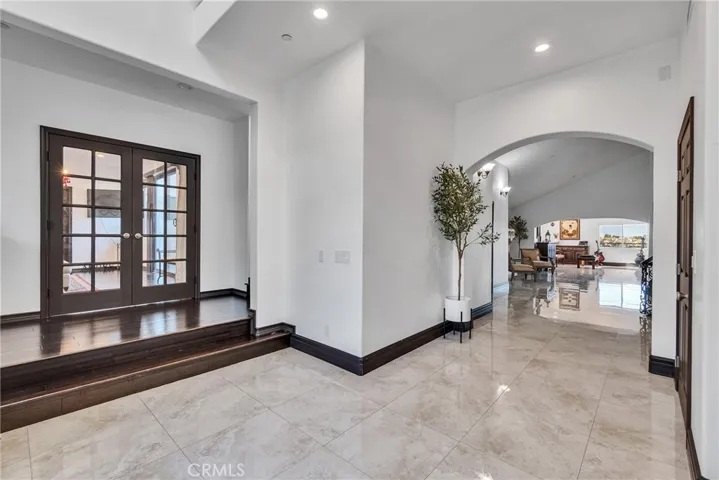 Steps to Double door enters into mother-in-law suite which includes a living room, bedroom, bathroom and side exterior entry for privacy