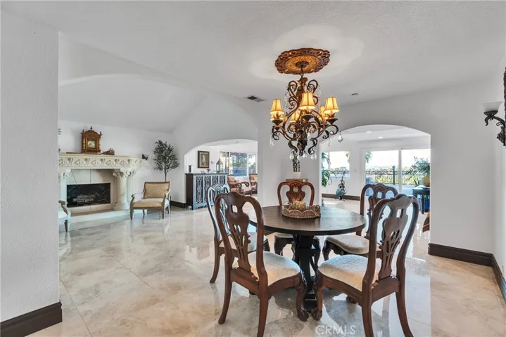 Formal Dining area facing fireplace and gorgeous outdoor view