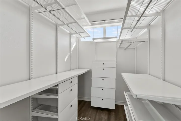 primary walk-in  closet
custom shelfs and draws