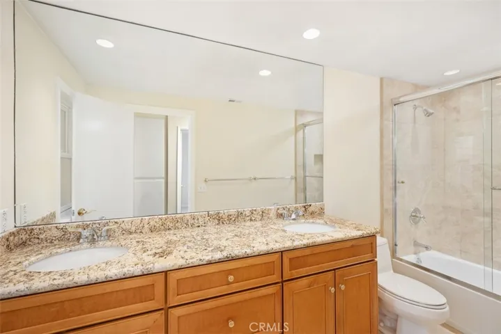 Guest bathroom #1 with a dual vanity.