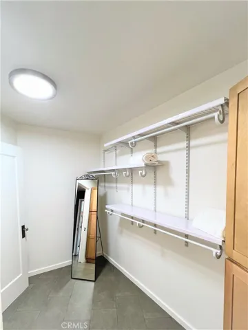 Walk in closet with built in shelving