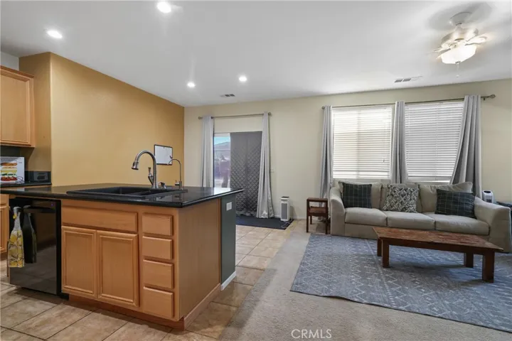 Family room opens to kitchen and breakfast area