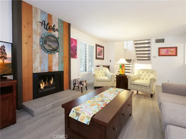 Spacious Living Room with Fireplace and High-End Laminate Floors