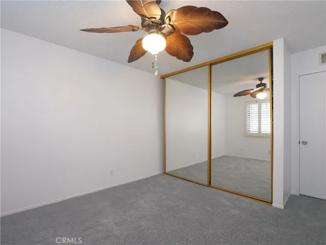 3rd Bedroom With Fan, Mirrored Closest Doors and Custom Closet Storage