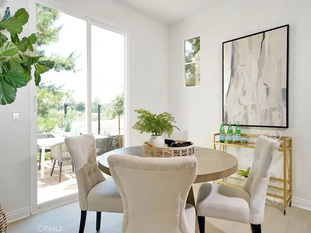 DINING AREA WITH VIEW OF PATIO AND OPEN SPACE