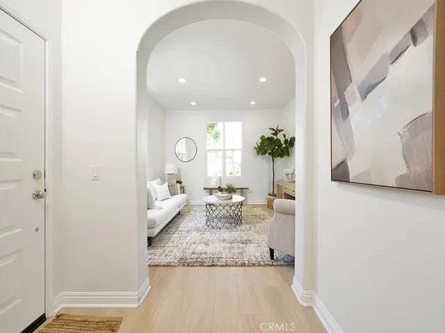 ENTRY LOOKING INTO LIVING ROOM