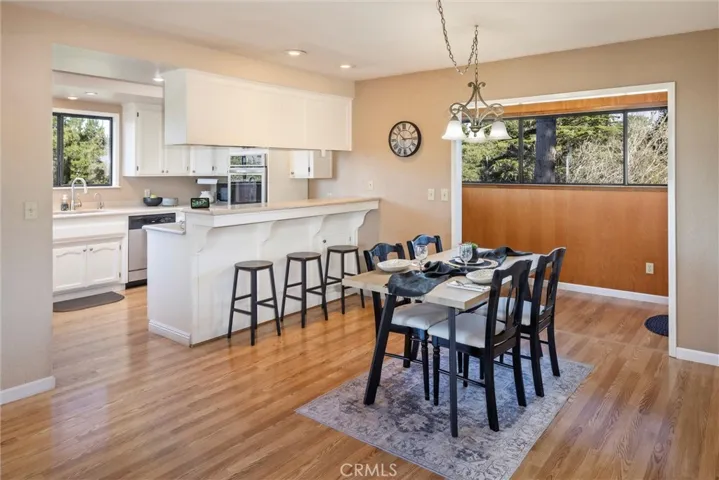 Dining area and view of kitchen.
