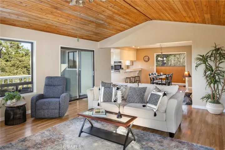 View of kitchen and dining area from corner of living room.