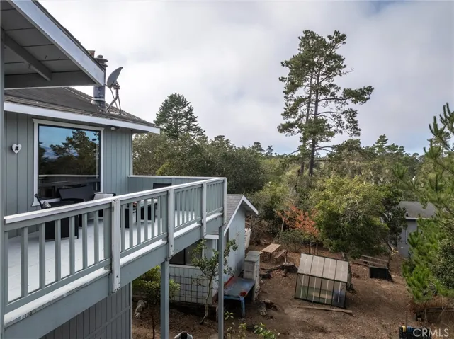 Another drone view of deck and carport with office/studio.