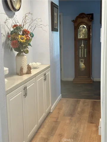 Hallway with quartz countertop and cabinets