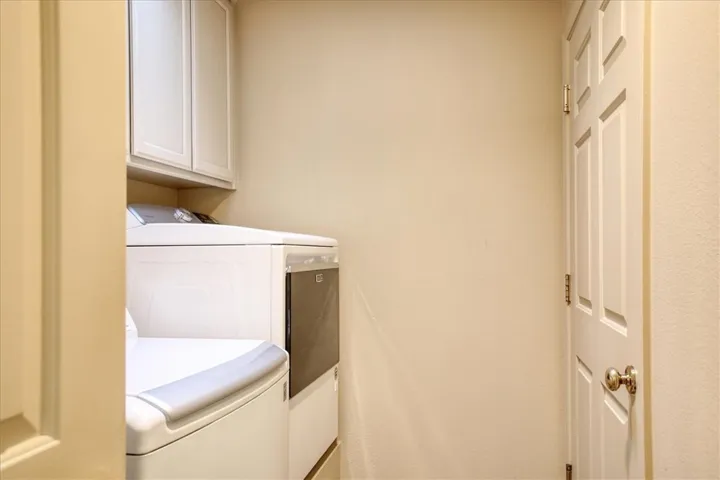 Laundry off kitchen, leads to garage