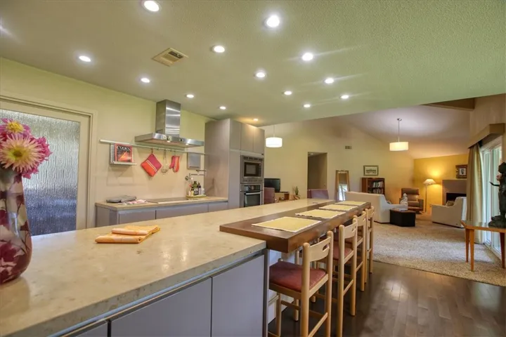 Limestone countertop and Black Oak breakfast bar.