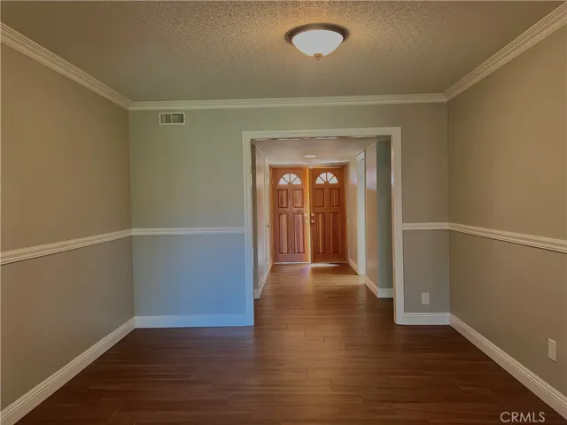 Looking into Formal Dining Room from Enclosed Dining Room