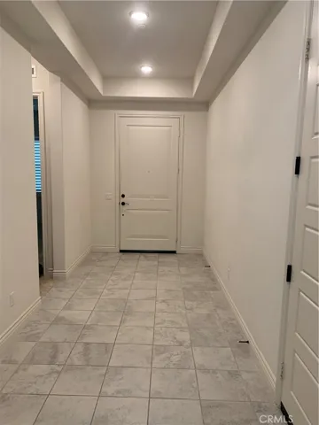 Formal entry with tile flooring