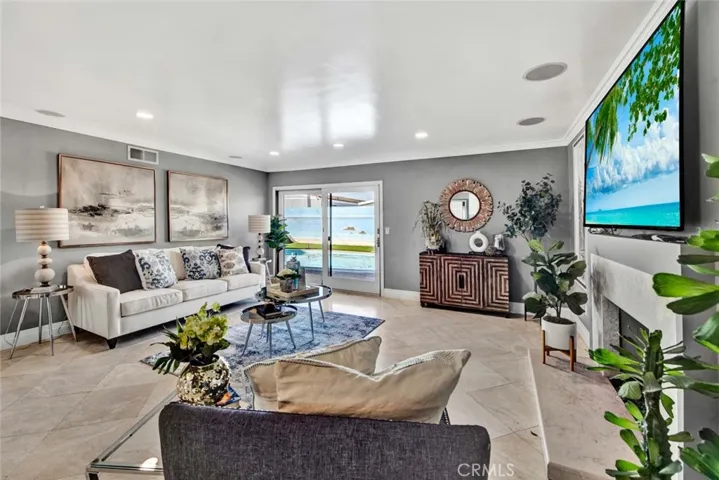 Throughout the home, you’ll find recessed lighting, extensive crown molding, high baseboards, and luxurious travertine flooring.