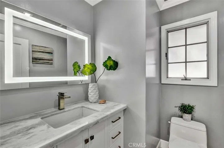 additional half bath near the kitchen and garage for added convenience