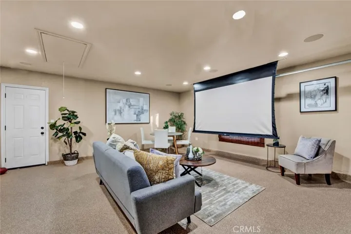 The finished garage features Automatic movie screen projector, epoxy floors and painted drywall