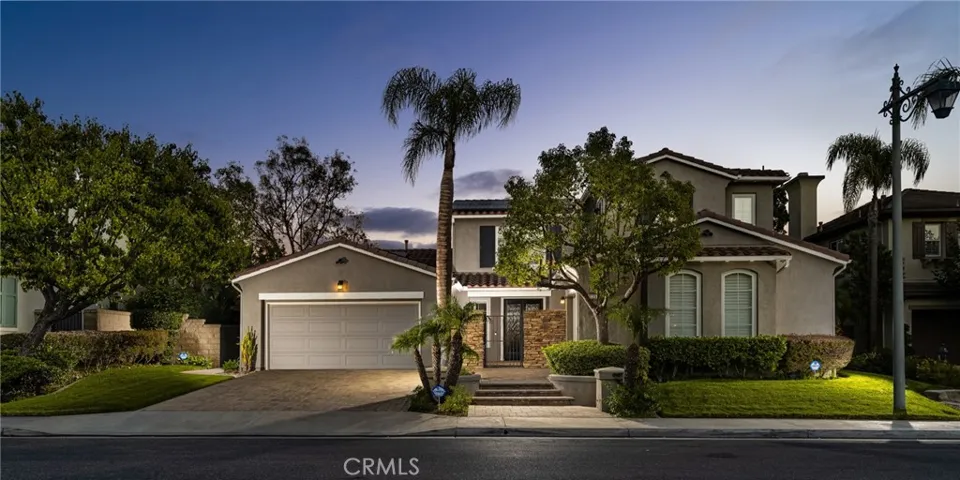 Beautifully Landscaped Dream Home with Newer Paver Driveway and Gated Entry
