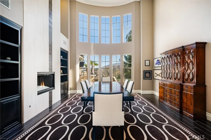 Luxurious Formal Dining Room with Views and Sophisticated Floor to Ceiling Fireplace