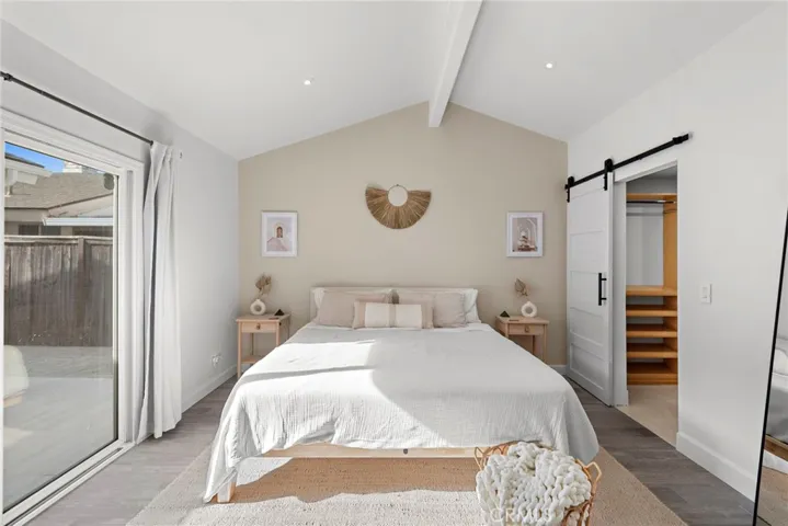 Master bedroom featuring slding door to private patio
