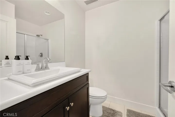 downstairs bathroom with walk in shower
