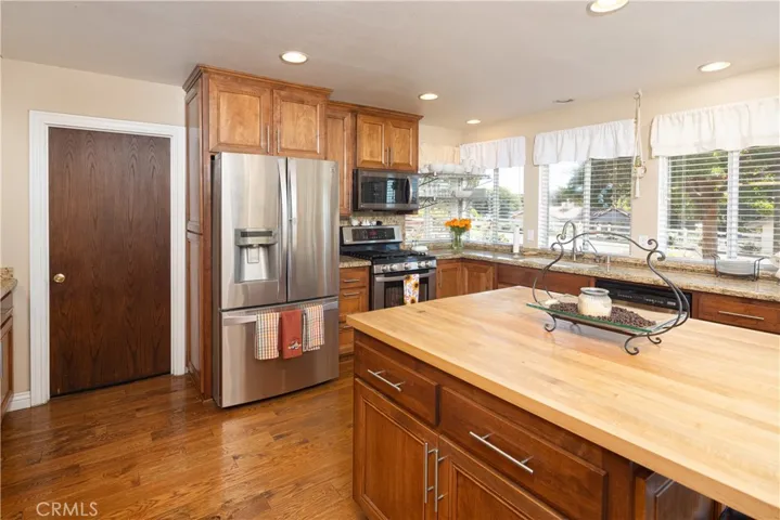 Comes with refrigerator and butcher block island.