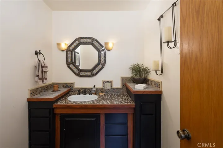1/2 bathroom off of kitchen and garage.