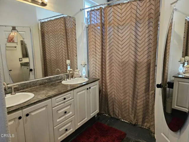 PRIMARY BATHROOM AND WALK-IN CLOSET