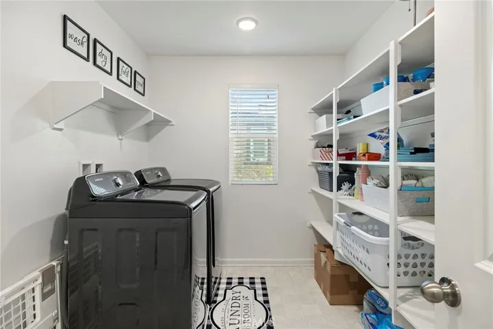 Upper level large laundry room.