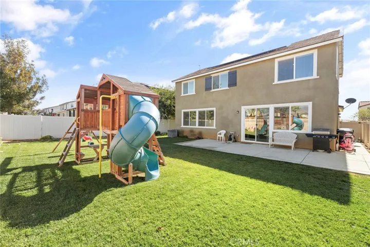 Back yard with lovely landscaping.