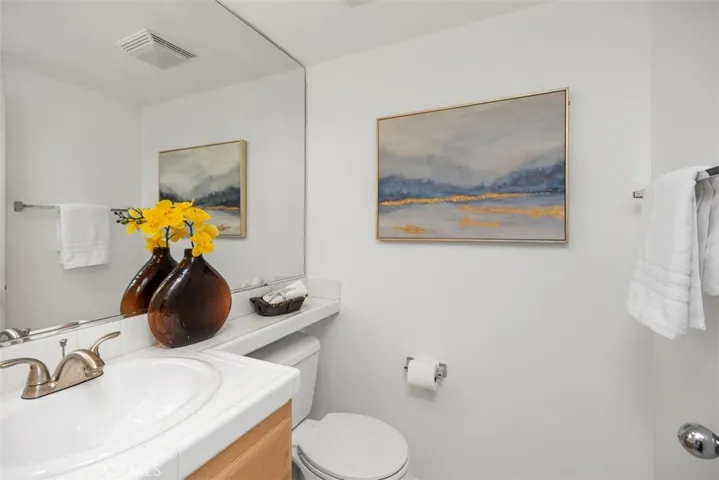 1/2 bath located near front entrance & Living Room