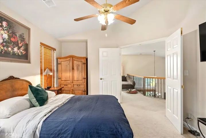 Master bedroom, doors open to the office/stairs to downstairs area
