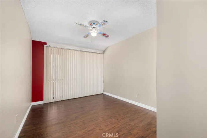 Bedroom 1 showcases laminate flooring.