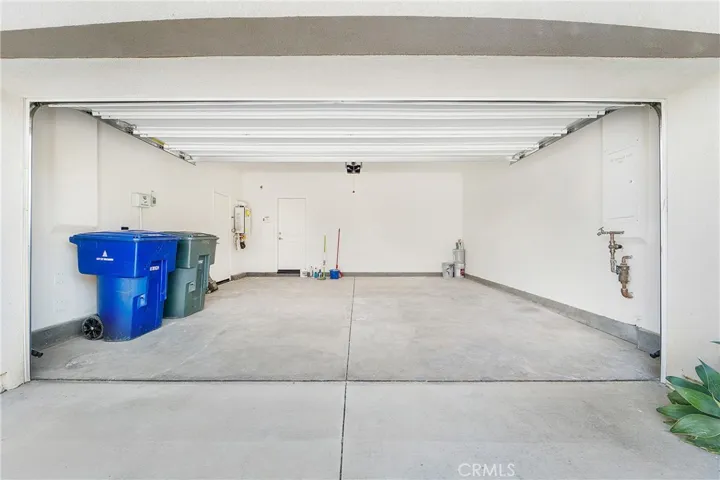 Fully finished, two-car garage. Note the extra space bc of the tankless water heater!