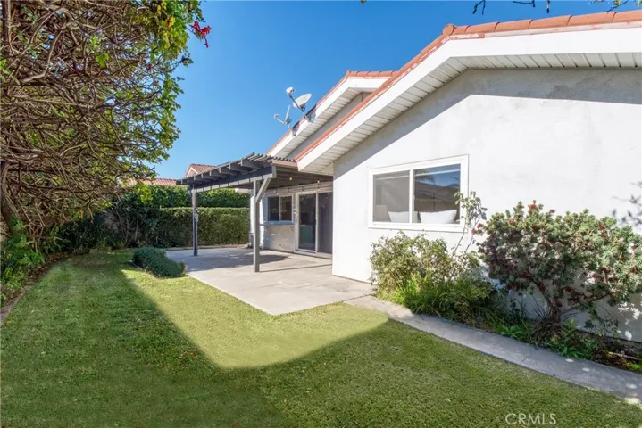 Backyard retreat with patio cover, perfect for outdoor enjoyment and BBQ's!