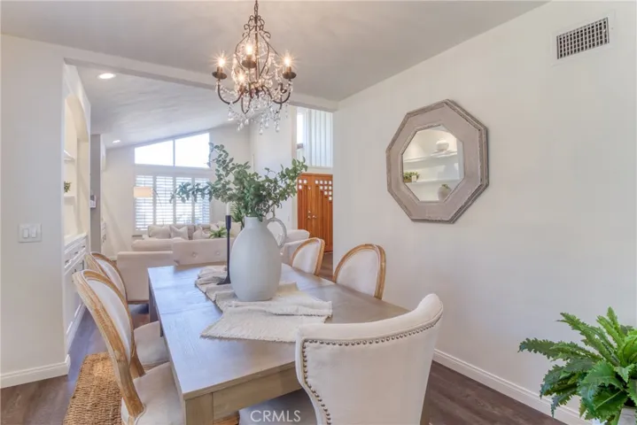 The living room floor has been uniquely modified to be on the same level as the dining room (no step down)~