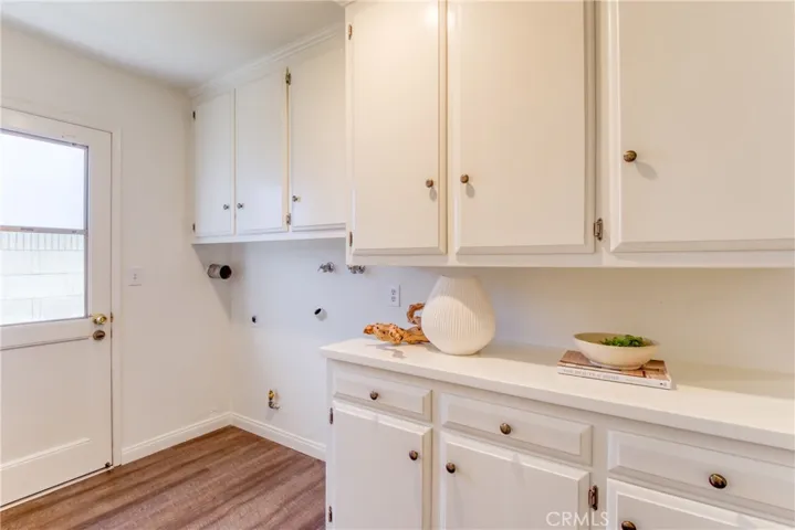 Inside laundry room area (gas or electric dryer hookups) and plenty of storage space!