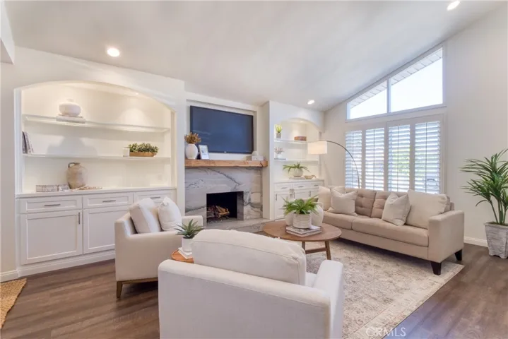 Vaulted ceilings in the living room with an array of natural light!