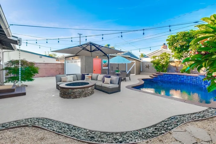 Resort stye back yard with sparkling pool
