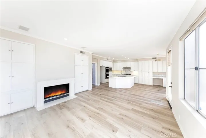 Double sided Fire place opens to Family room and Formal Living Room