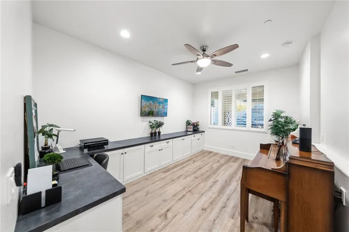 Office space behind the kitchen with built-ins