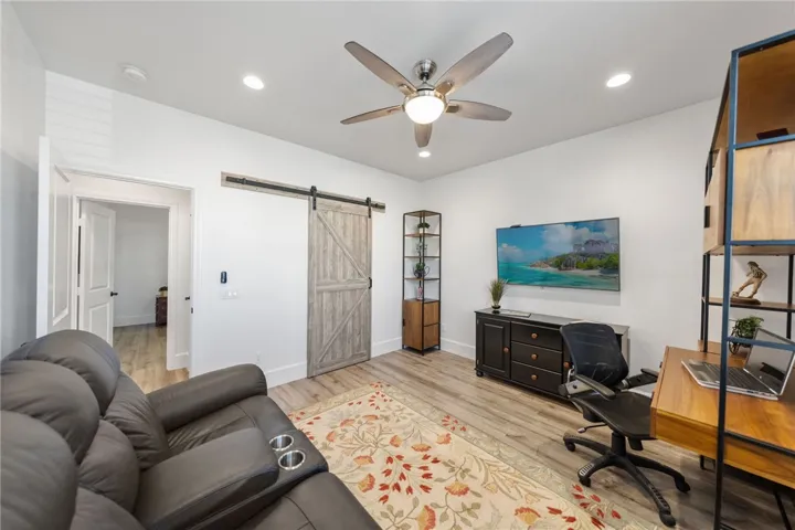 Secondary bedroom #1 with walk-in closet with barn door